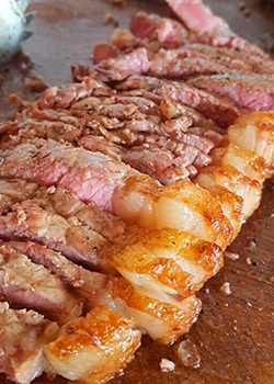 Picanha fatiada no ponto ideal do churrasco Diamante Premium